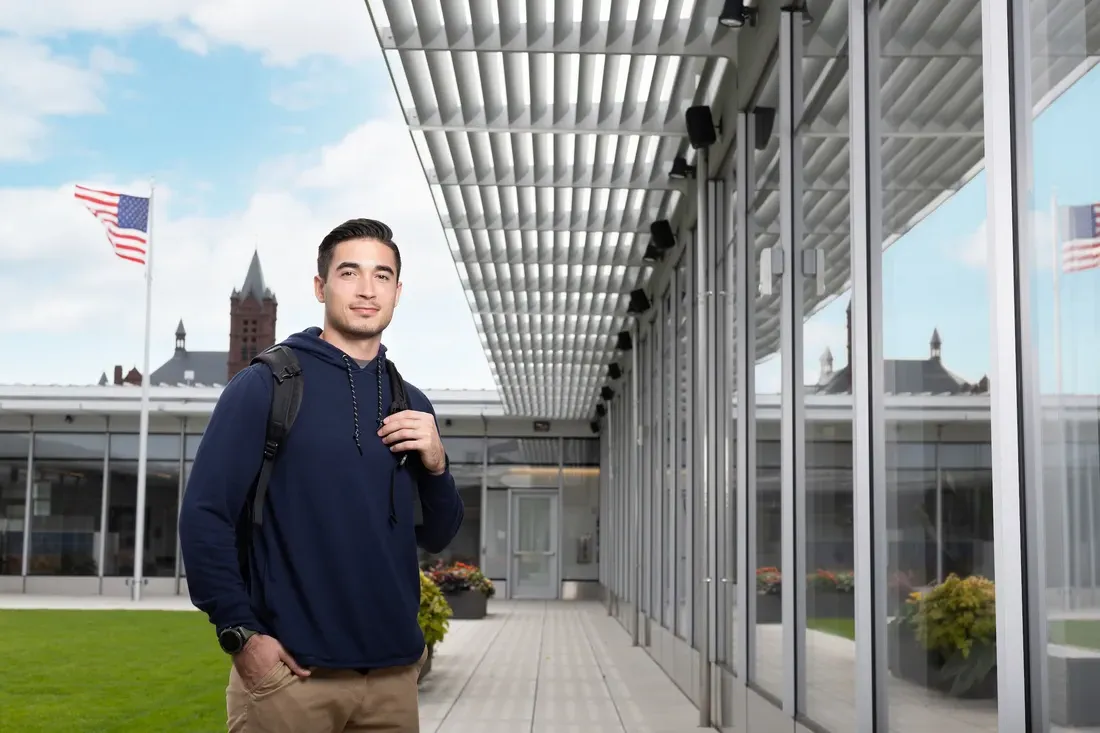 Veteran ambassador student Jack Pullano standing and smiling.